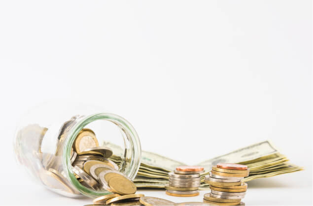 Bills and pennies placed on a white background.