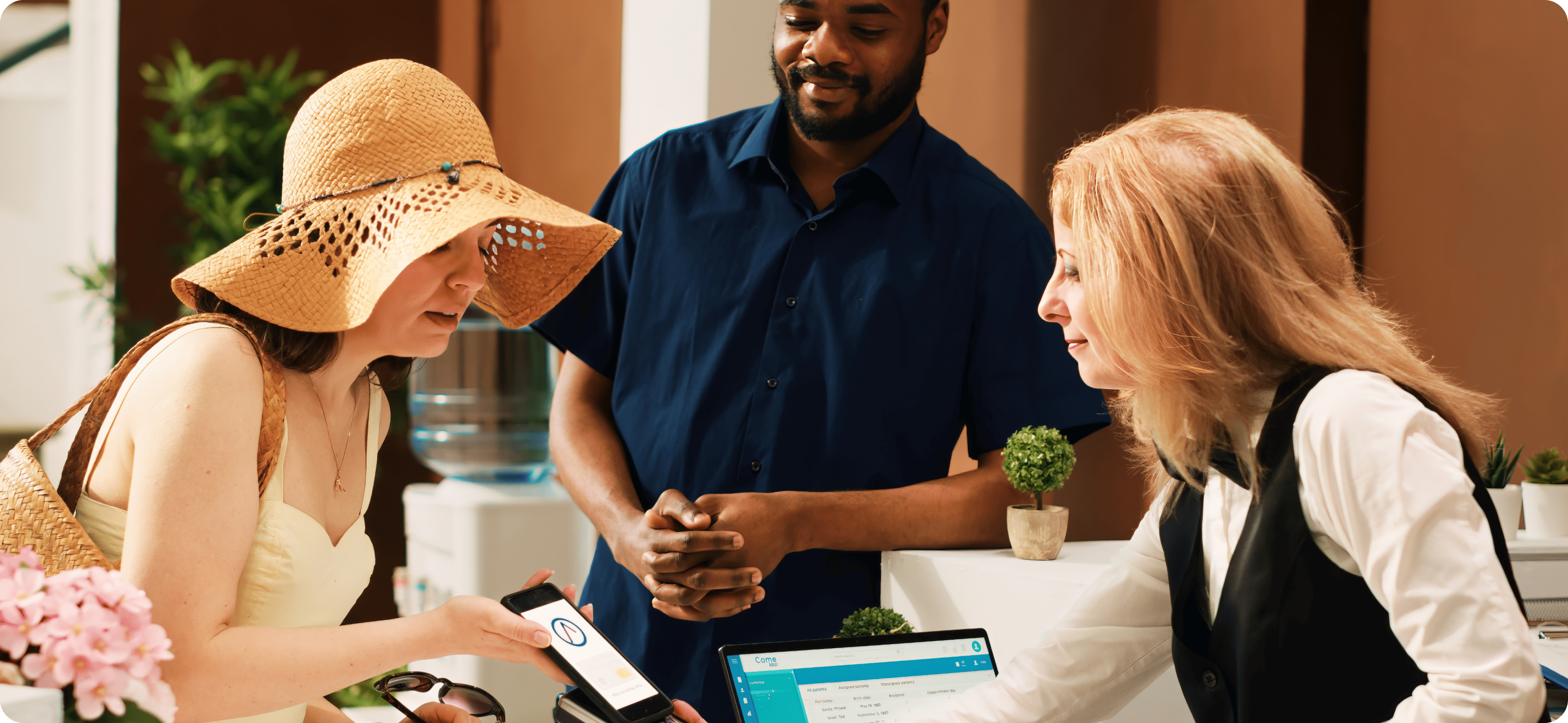 A woman showing her phone to the staff in front to verify something.