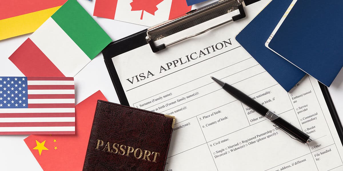 Showing Visa Application form with Passport and country Flag - Easy Tourist Card