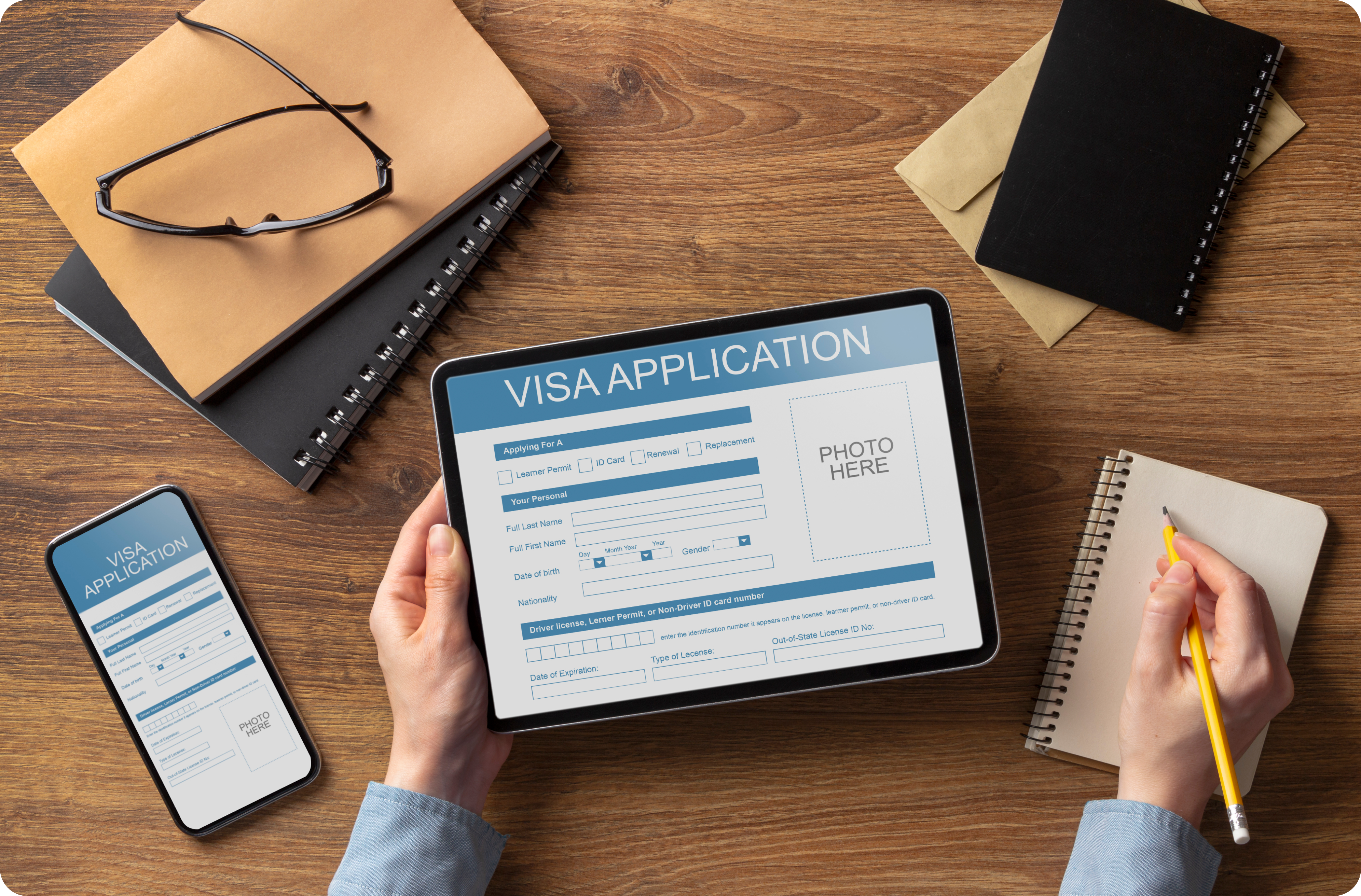 A visa application form open in a tablet a mobile phone